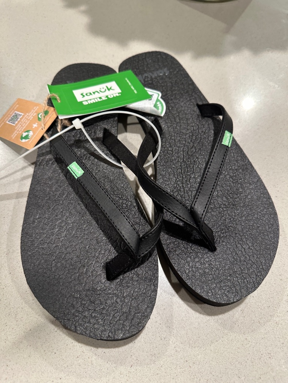Sanuk Black Flip Flop Sandals with Green Logo Tag .